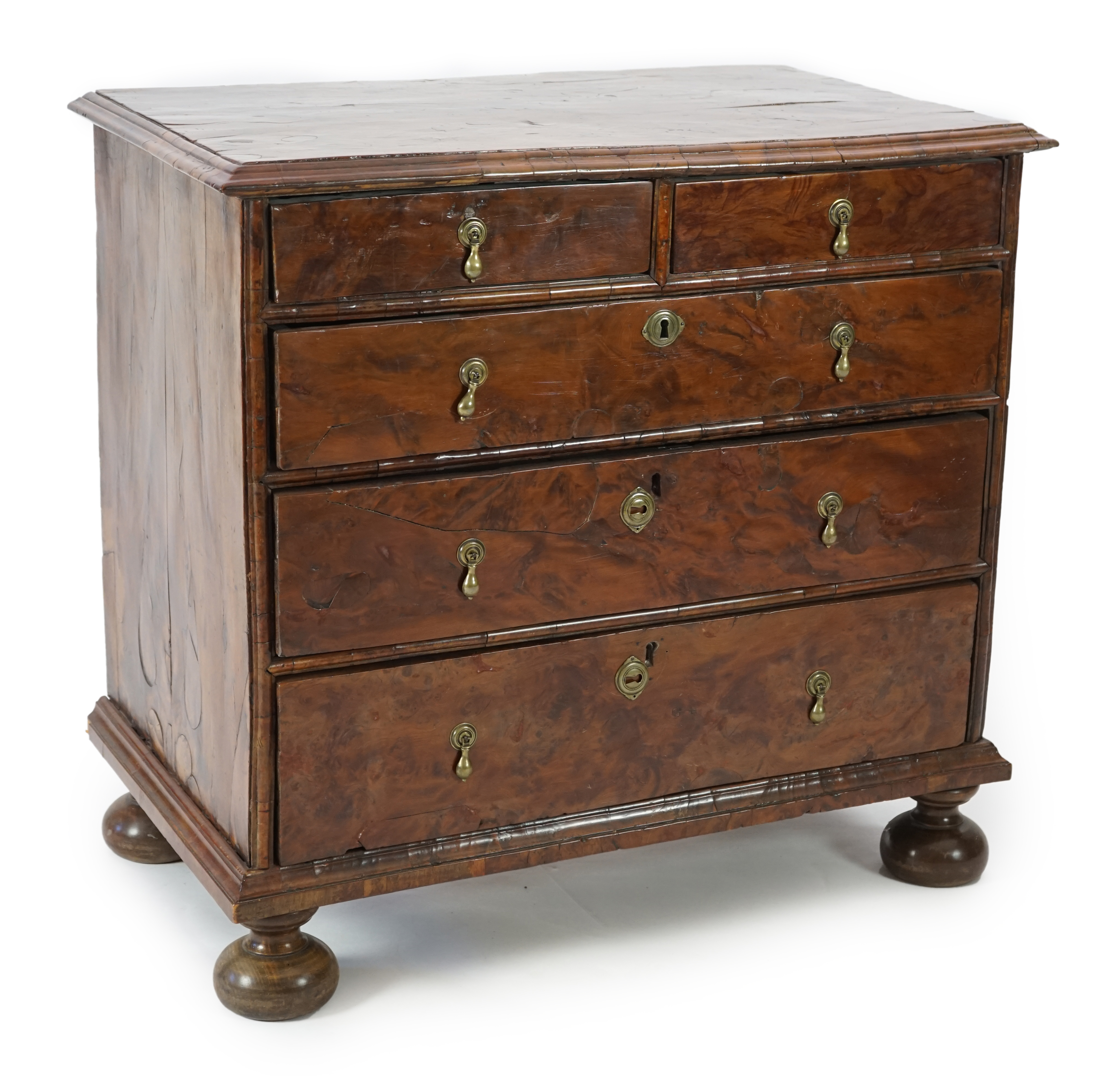 An early 18th century and later yew wood veneered oak chest